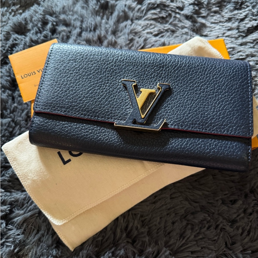 Louis Vuitton Black Wallet with Textured Leather and Gold Logo